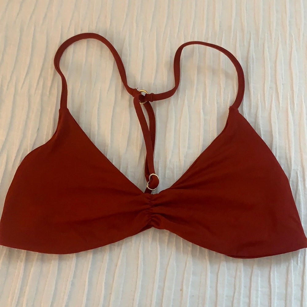 Burnt orange bathing suit top.